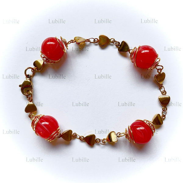 Bracelet or "bonbon rouge"